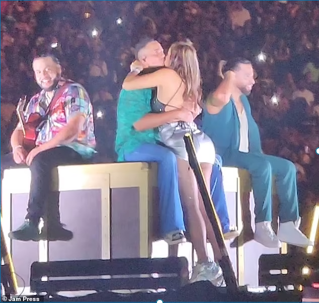 Furious husband ‘divorces’ influencer wife after she’s filmed leaping on stage to kiss US singer during live performance