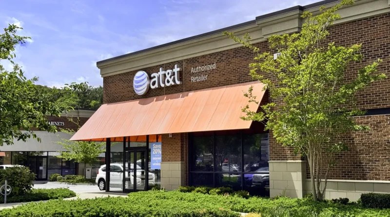 Front of an AT&T store with an orange awning and the AT&T logo