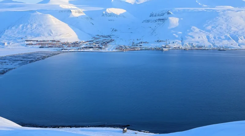 View over the snowy Arctic town of Longyearbyen and its fjord in Svalbard